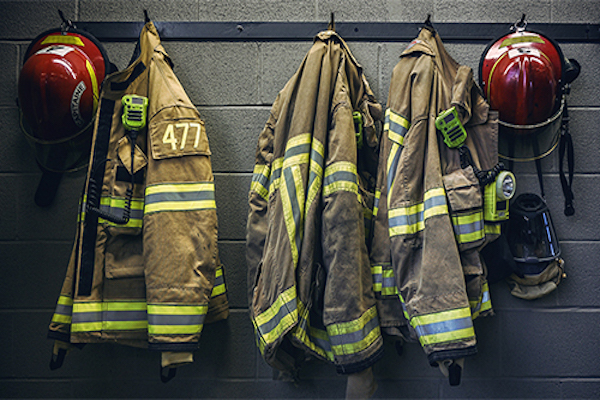 Photo of firefighter coats hanging 