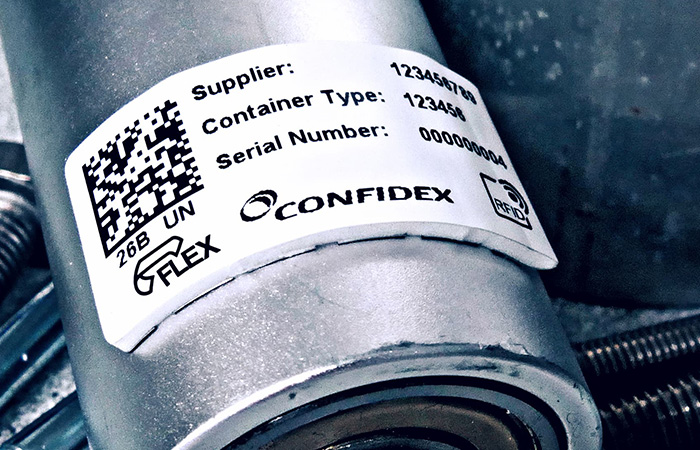 The image showcases a high-resolution, durable barcode label from Confidex, attached