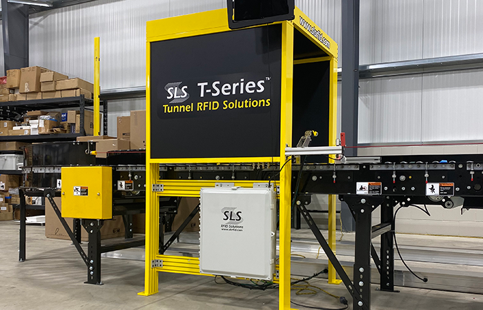 SLS T-Series Tunnel RFID Solutions equipment in an industrial warehouse, highlighting advanced tracking capabilities for improved logistics and user experience.