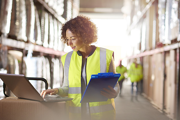 person-with-safety-vest-working-on-computers
