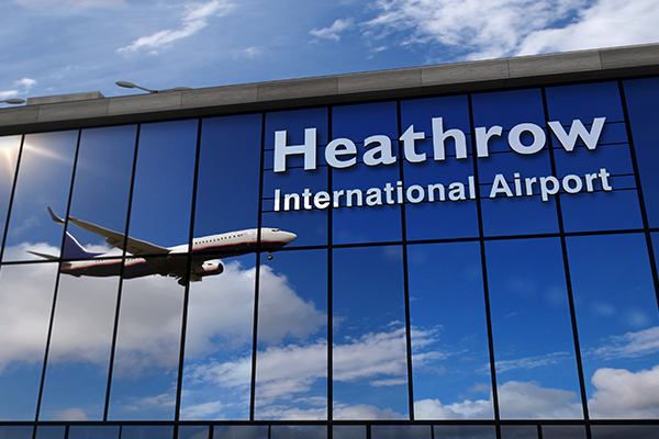 The image showcases the iconic Heathrow International Airport, with its name prominently displayed on