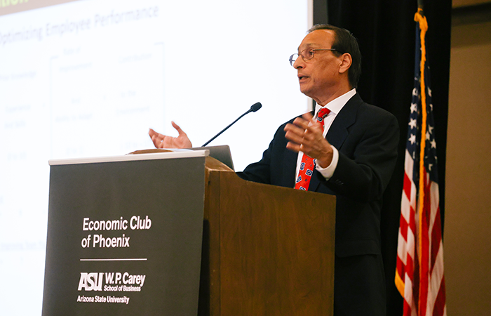 Presenter at Economic Club of Phoenix discussing employee performance, embodying Impinj's commitment to providing valuable insights and enhancing user experience.
