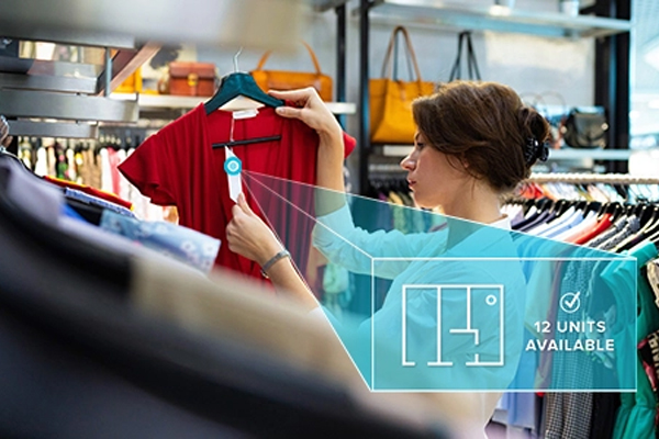 Photo-of-women-holding-red-shirt-with-tag