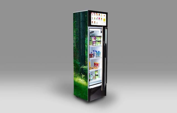 Innovative forest-themed vending machine with digital display by Impinj