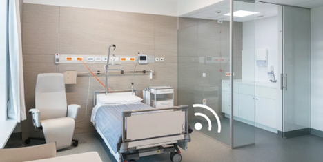 Modern hospital room interior with advanced medical facilities and patient bed