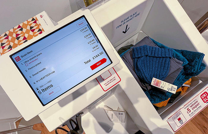 In the image, a modern retail checkout experience is showcased, featuring an advanced Imp