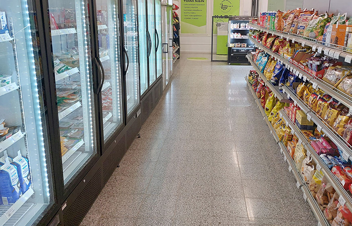 This image showcases a well-organized grocery store aisle with a variety of products neatly
