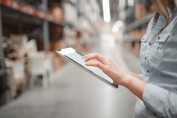 Picture of tablet being used in warehouse setting