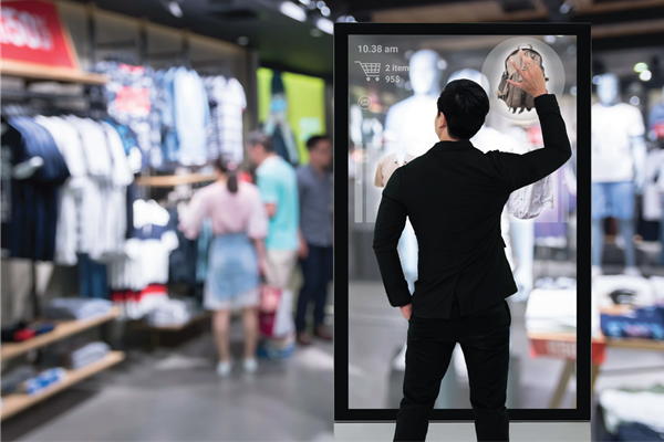 A retail professional interacts with an advanced digital inventory management system on a transparent screen,