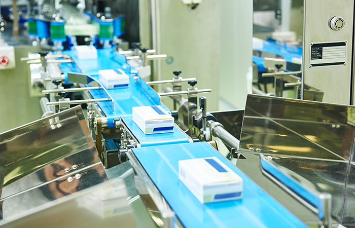 This image showcases a modern, high-tech conveyor system within a production line, possibly