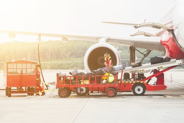 photo-of-truck -unloading-baggage-from-plane