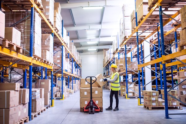 Image of warehouse employee scanning boxes