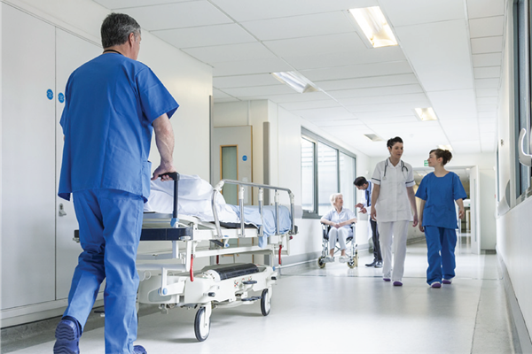 photo-of-Nurse-pushing-cart-hospital