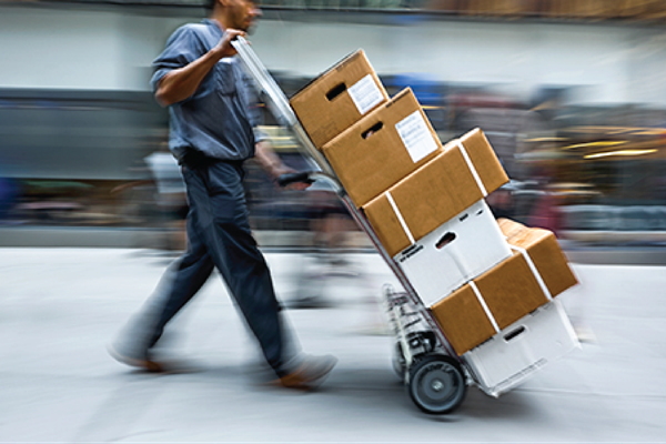 photo-of-delivery-man-with-packages