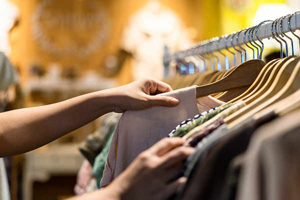 individual picking out clothes