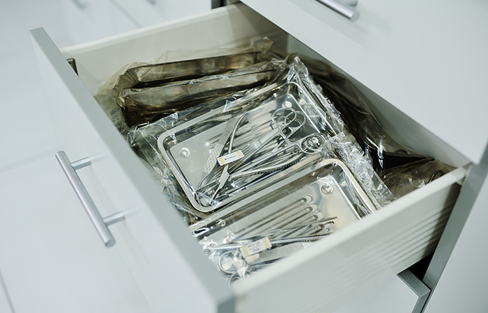 Sterile medical instruments organized in a drawer, representing Impinj's efficient healthcare solutions.