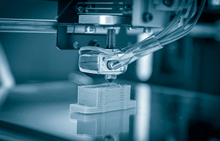 The image showcases a close-up view of a 3D printer in the process