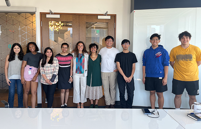 Impinj interns standing together in the office, highlighting the company's dedication to intern development and teamwork