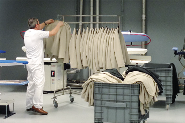 Photo of laundry room with coats hanging